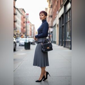 Navy Turtleneck Ellen Tracy Paired with a Ellen Tracy Gray Pleated Skirt c close